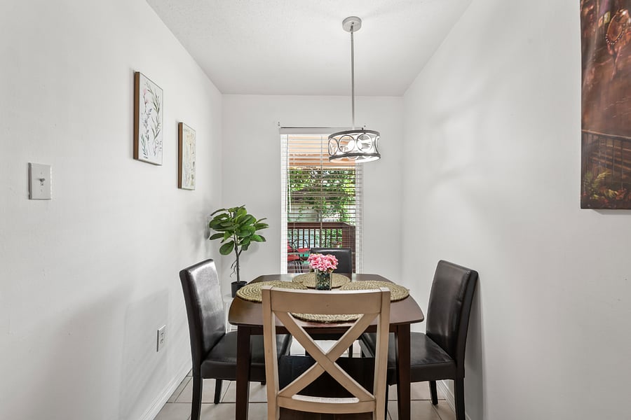 Charming dining room bathed in natural light, perfect for enjoying meals or morning coffee. This inviting space is located just off the kitchen and benefits from bright sunlight streaming in from the front porch. Whether youre dining solo or entertaining guests, the airy ambiance makes every meal feel special.