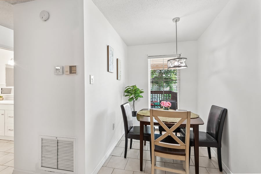 Charming dining room bathed in natural light, perfect for enjoying meals or morning coffee. This inviting space is located just off the kitchen and benefits from bright sunlight streaming in from the front porch. Whether youre dining solo or entertaining guests, the airy ambiance makes every meal feel special.