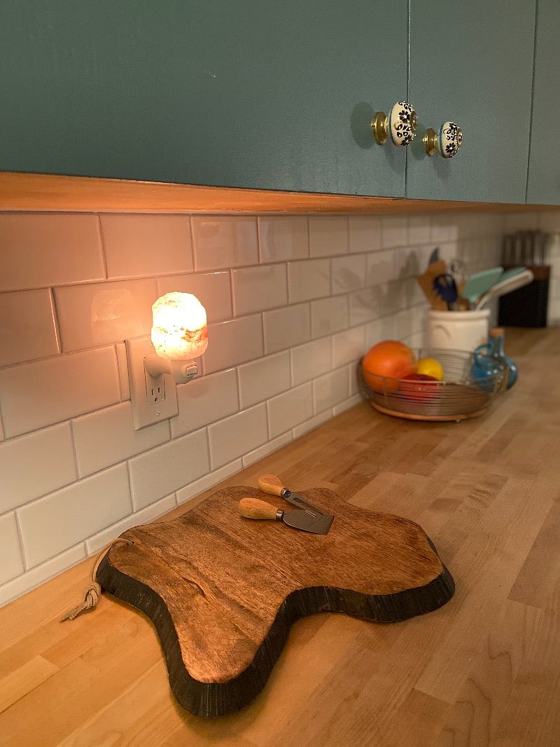 newly renovated kitchen with butcher block and subway tiles.