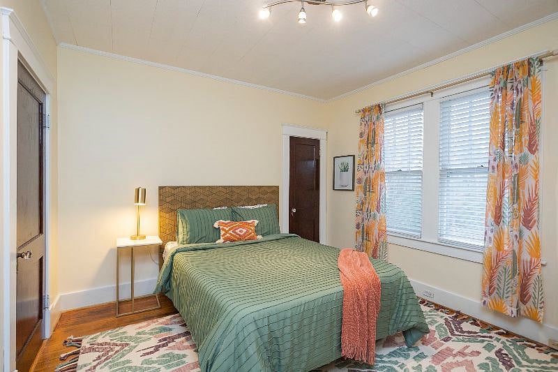A Queen bed is in this bedroom.