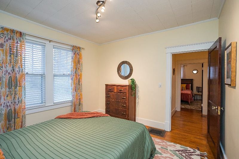 A Queen bed is in this bedroom.