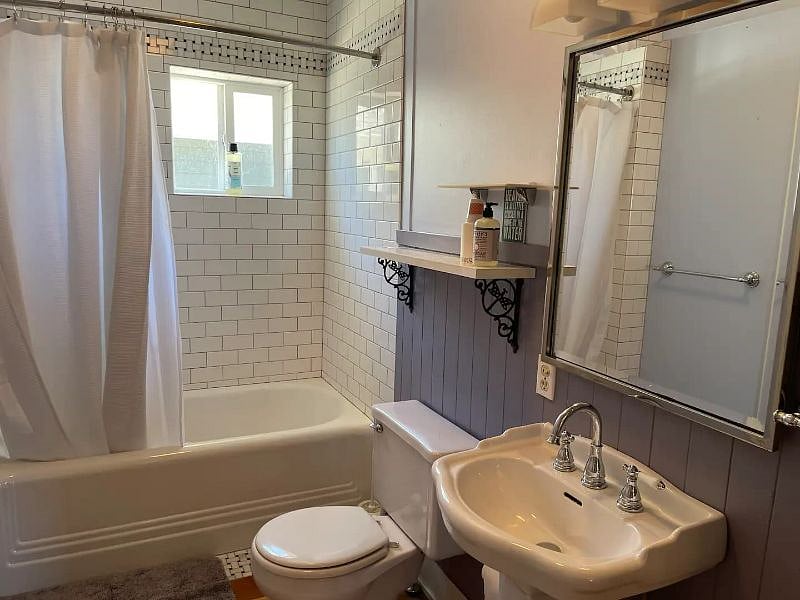 Recently remodeled downstairs full bathroom. Tile goes to the ceiling. 