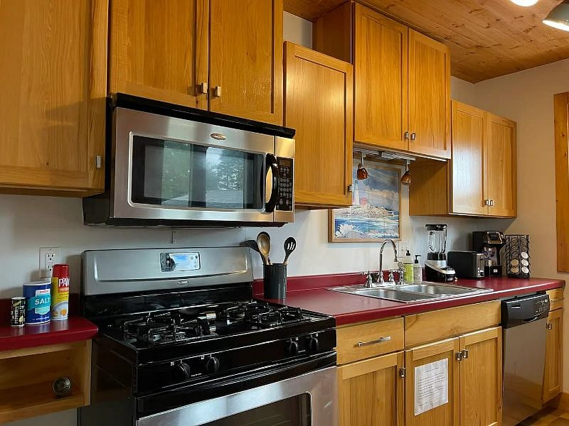 Loads of cabinet space. Microwave, dishwasher, refrigeration, gas range. Beautiful custom built cabinets. 