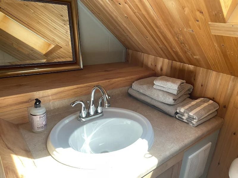 Upstairs bathroom sink, also a large shower. 