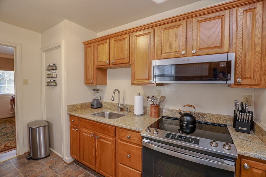 The kitchen has been newly renovated with lovely granite countertops, new stainless appliances and a new sink and touchless faucet.