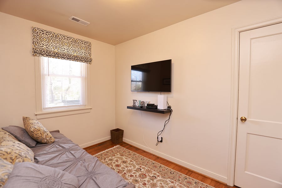 Bedroom 1 includes a daybed with trundle and has two twin beds and a closet with hangers.  However, this room can also be used as a dedicated office or sitting room as it has a desk and an LG 45 inch 4k LED WebOS Smart TV.