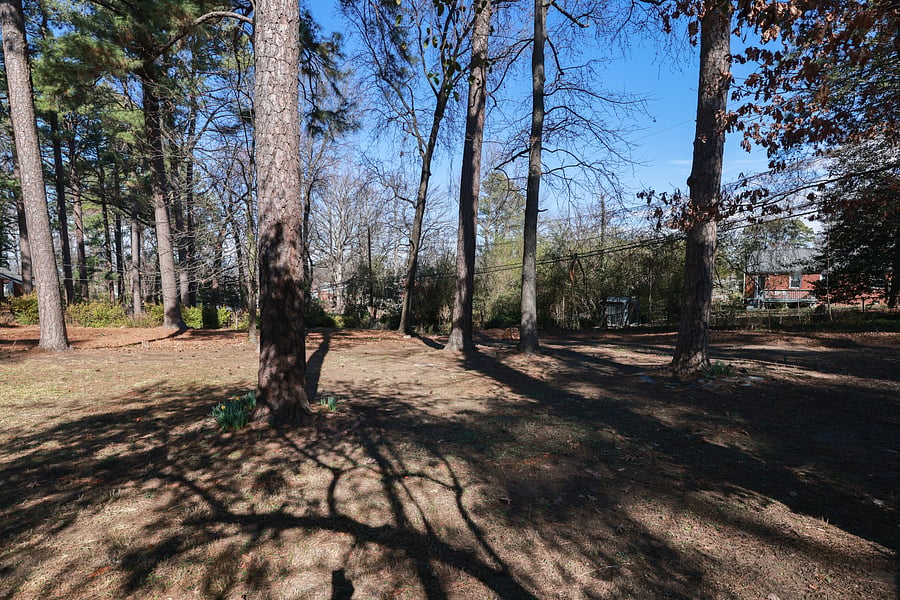 The home has a private, park-like lot with mature trees.