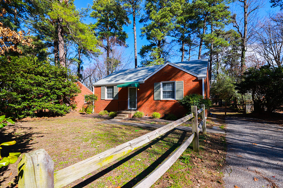 A charming all brick ranch with recently refinished hardwood floors, new windows, updated kitchen and bath and new deck.  