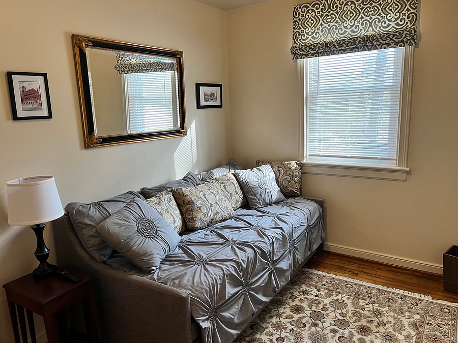 Bedroom 1 includes a daybed with trundle and has two twin beds and a closet with hangers.  However, this room can also be used as a dedicated office or sitting room as it has a desk and an LG 45 inch 4k LED WebOS Smart TV.