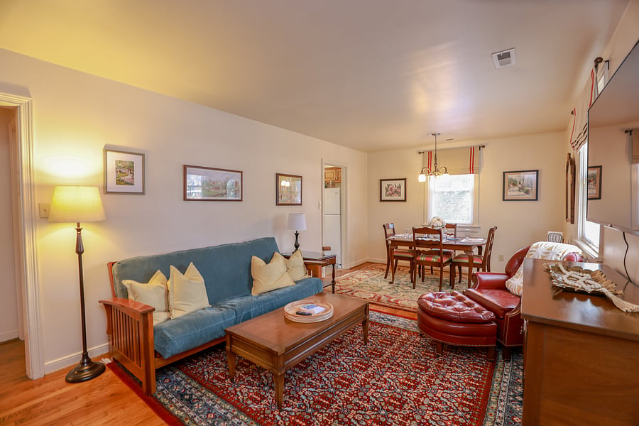 Large, open living room with plenty of natural light and comfortable furniture to sit back, relax and watch your favorite program on the Phillips 55 inch 4k 