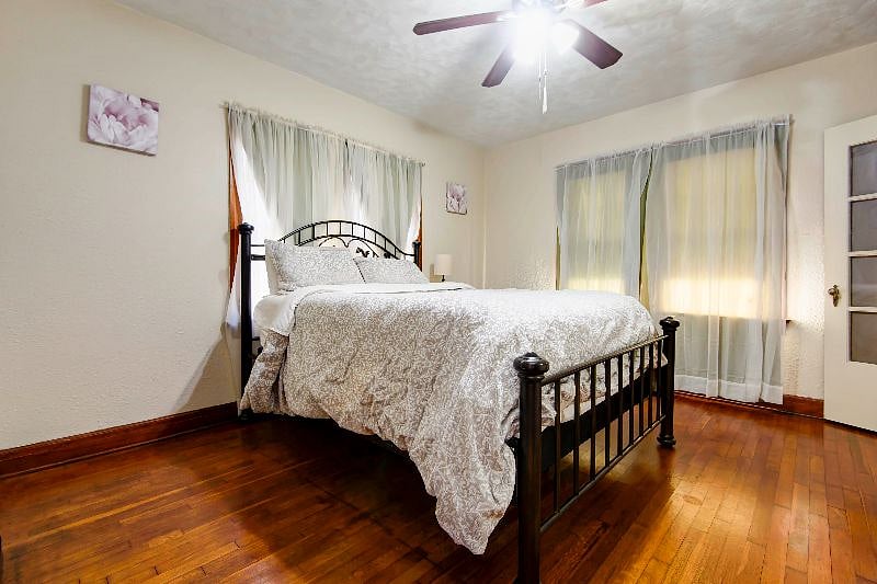 Bedroom 3 has a Queen size bed, ceiling fan, and plenty of natural light.