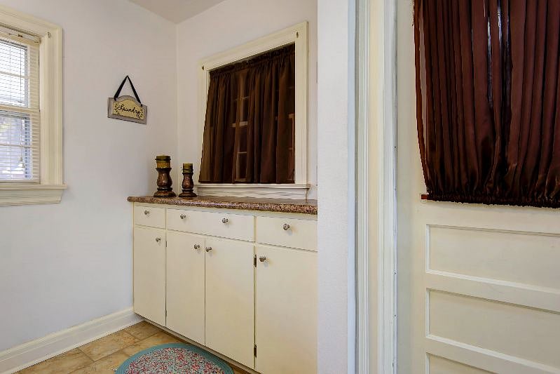 Laundry room with storage and folding counter.