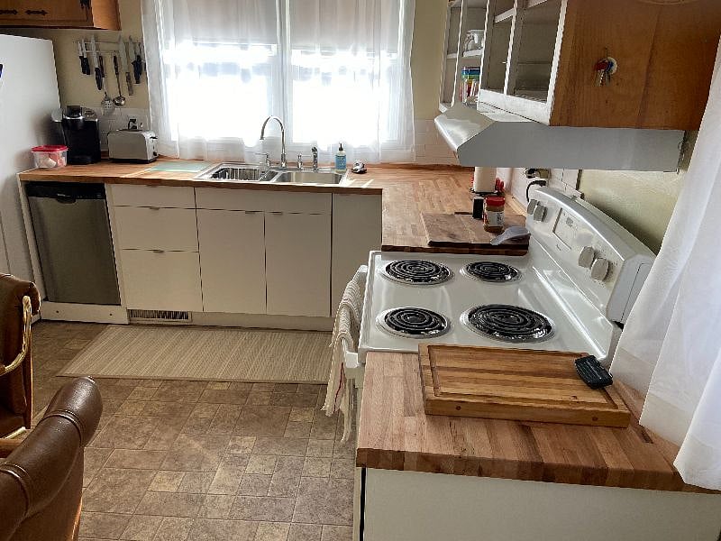 Kitchen, all new cupboards, sink, butcher block counter top, etc.