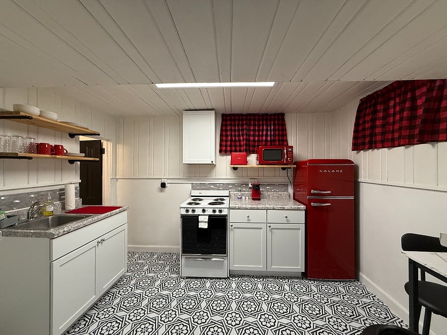 Fully stocked kitchen with plates, cups, utensils, and pots and pans for cooking, has been recently renovated!