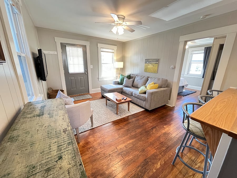 comfortable, cozy living room with bedroom adjacent