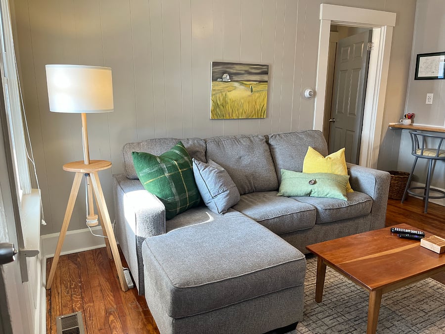 L-shaped sofa for lounging and watching wall-mounted Roku TV