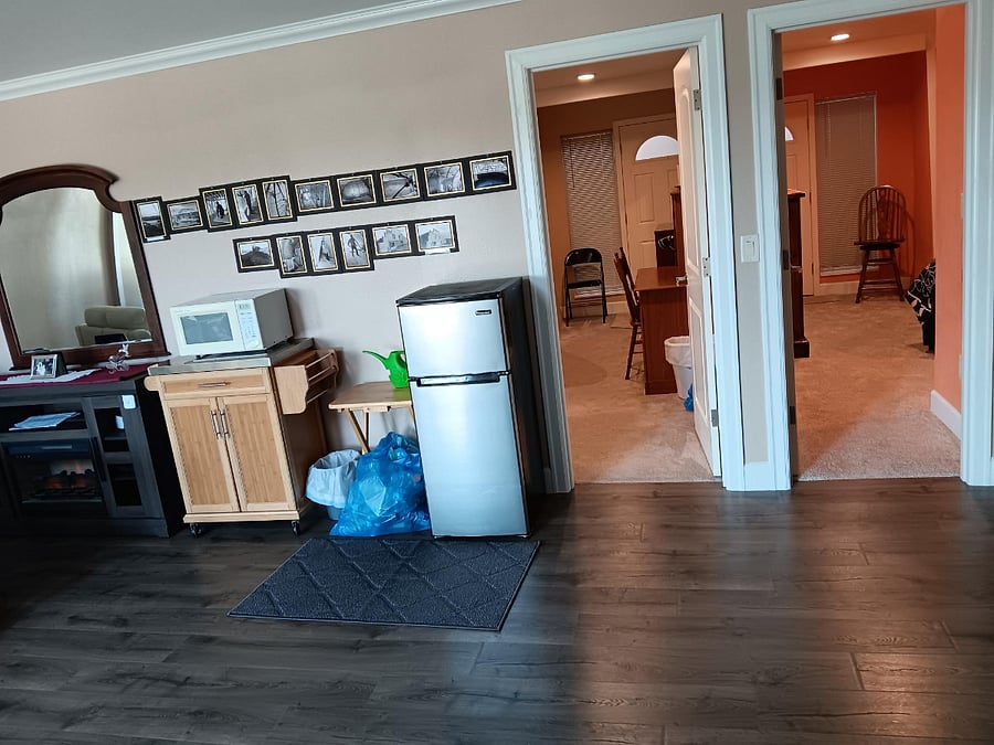 Bedroom entrances with amenities near your door: microwave, mini refrigerator, rolling furnished cabinet, etc.