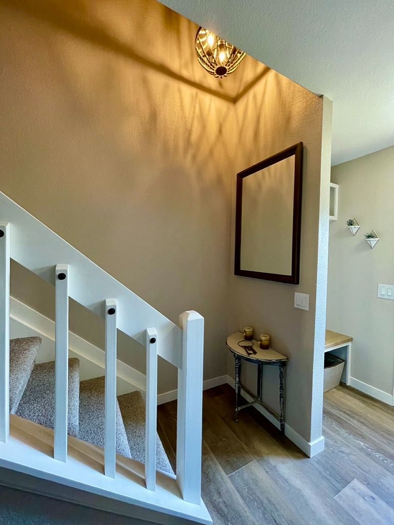 Front Entry and stairway leading to master bedroom, second bedroom and bathroom