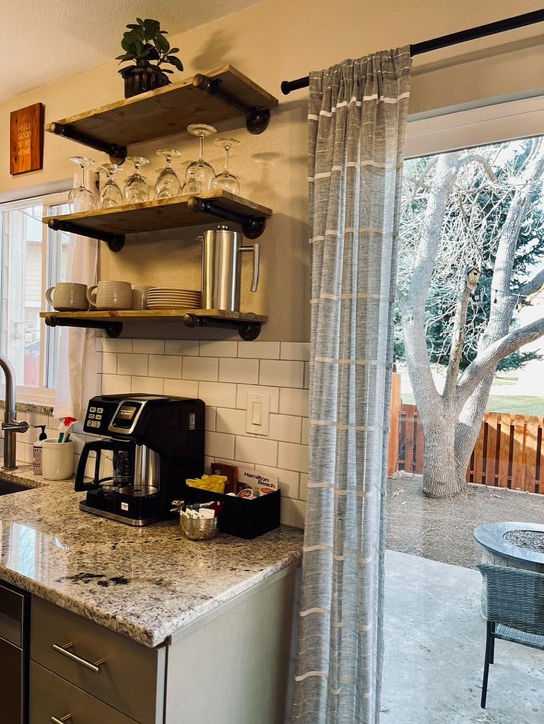 Kitchen with Coffee / Tea station and sliding door leading to backyard.