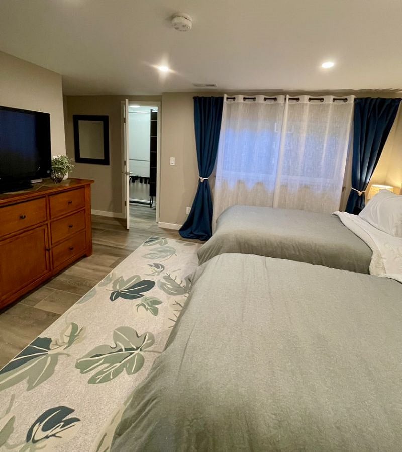 Basement Bedroom - looking toward the closet and full egress window.