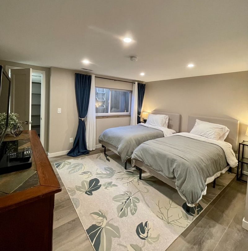 Basement Bedroom - looking toward the closet and full egress window.