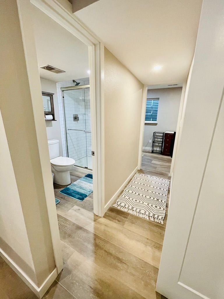 Basement Bedroom - looking toward the 3.4 Bath and down the hall to the Office
