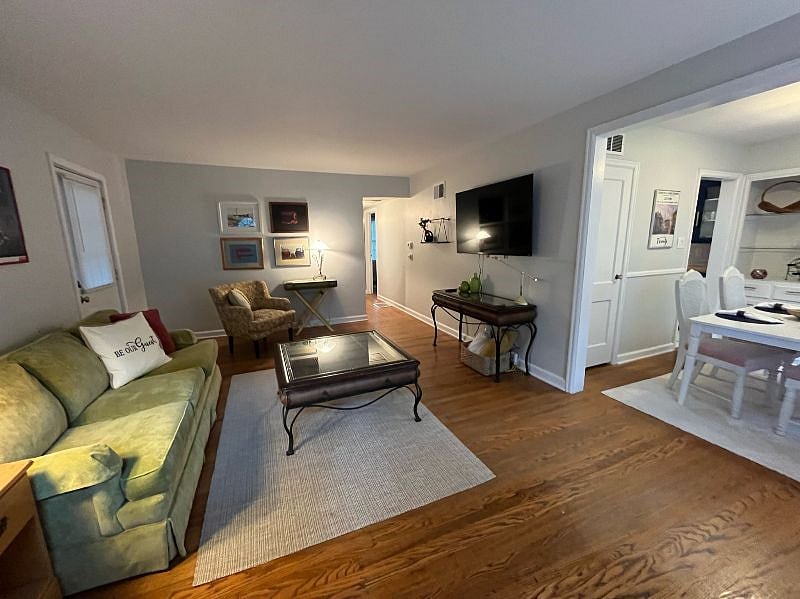 Bright and spacious living room with sleeper sofa.