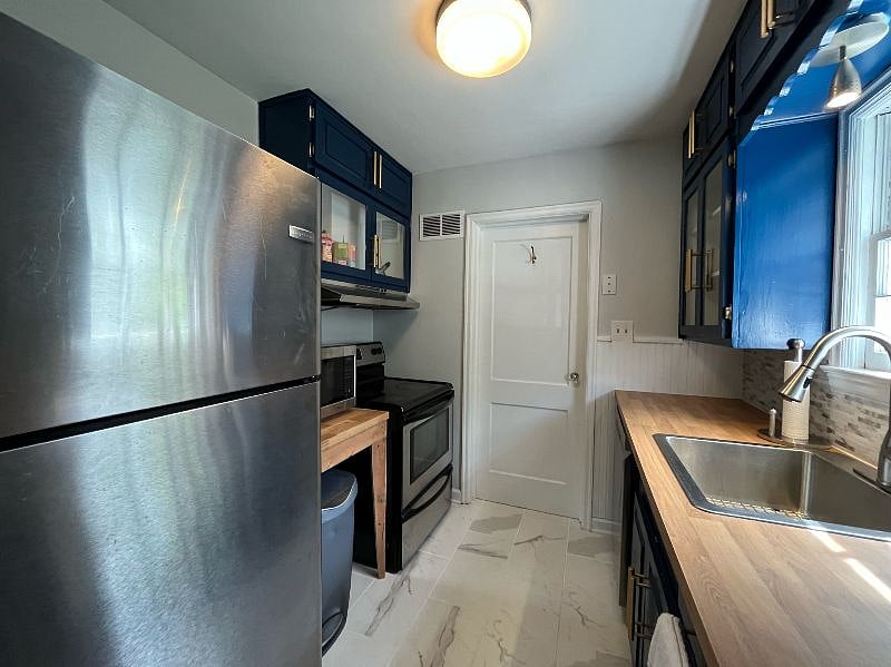 Full size fridge, oven, stove, dishwasher, microwave.