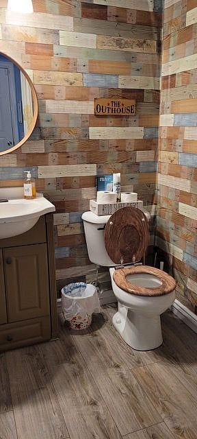 Bathroom near kitchen and garage