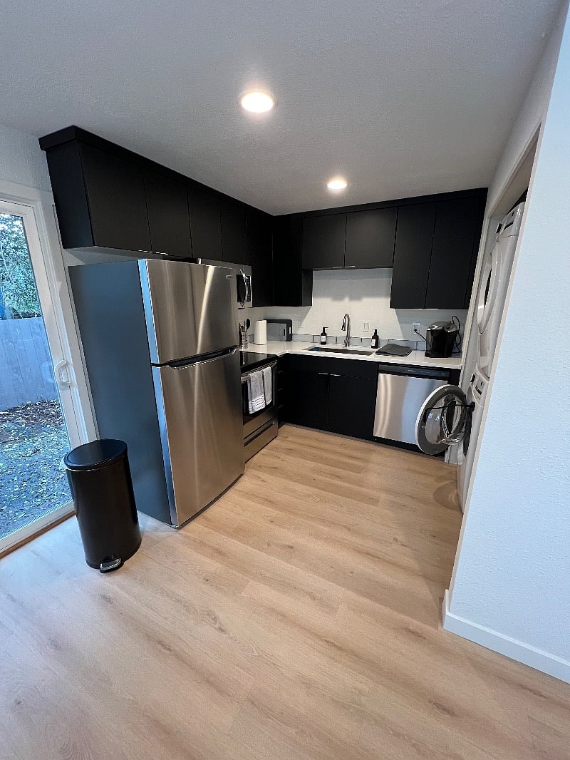 All new appliances: stainless steel fridge/freeze, range, and microwave with deep farmhouse style sink
