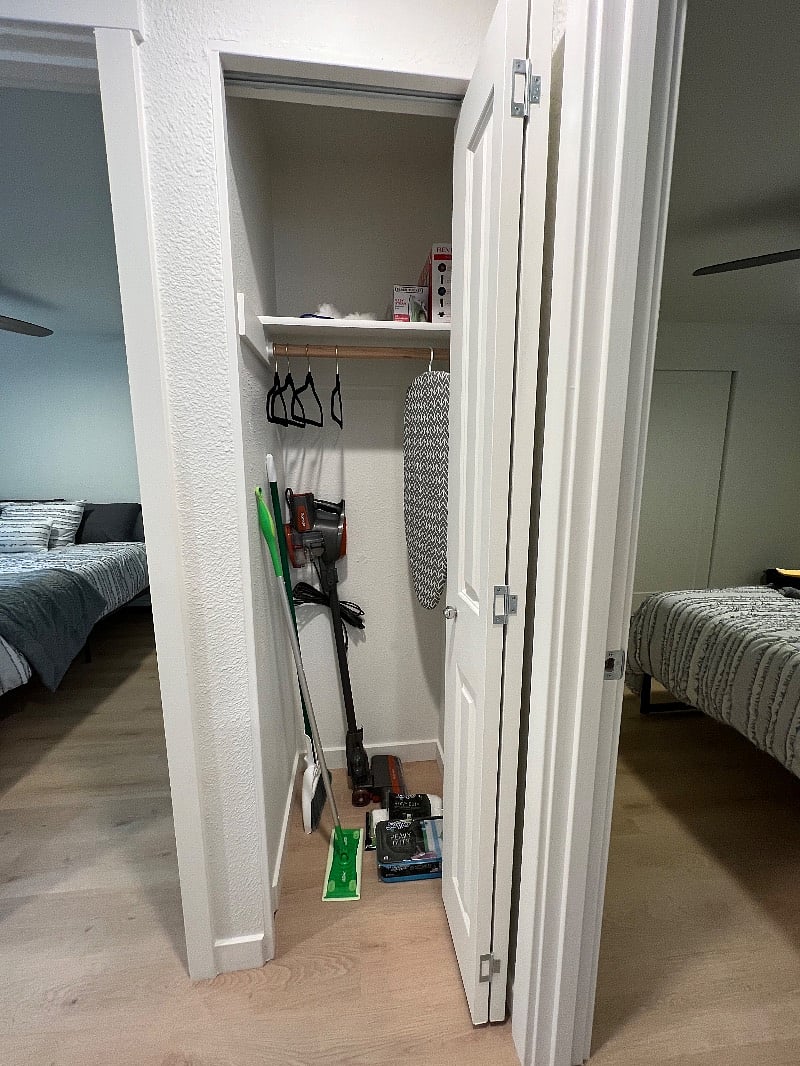 Cleaning items provided within coat closet