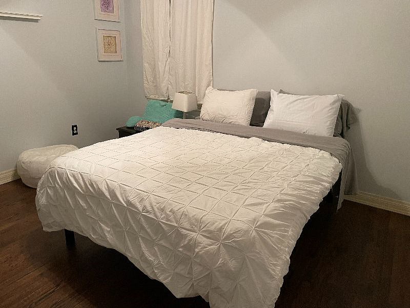 Main floor guest room with queen bed