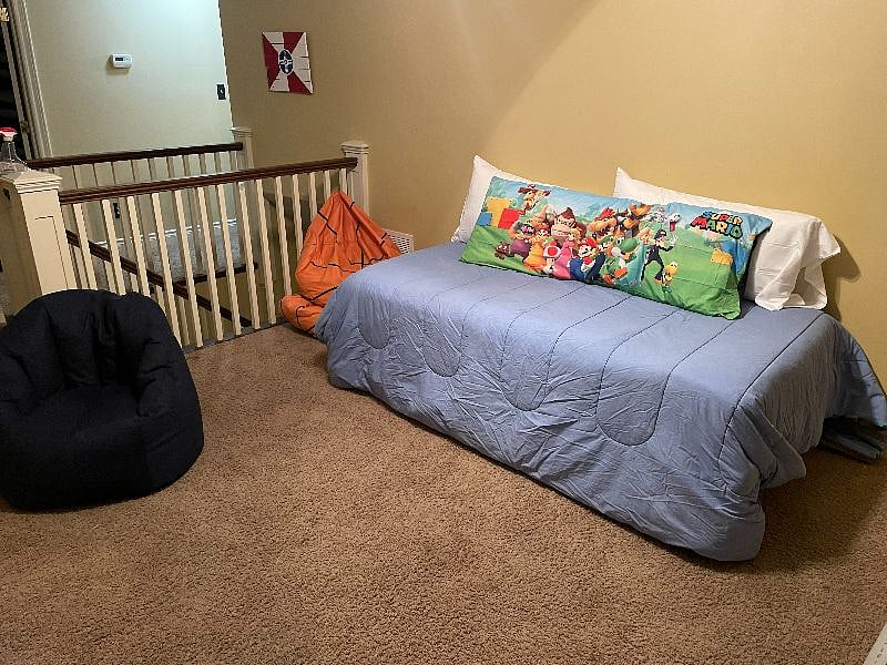 Upstairs loft with twin bed, bean bag chairs and Roku TV