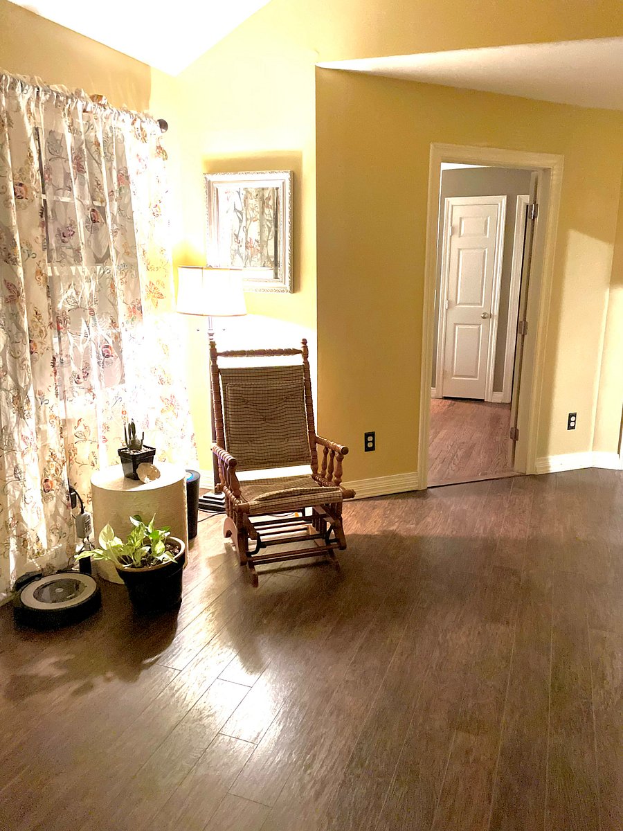 Sitting room near front entry with rocking chair and desk