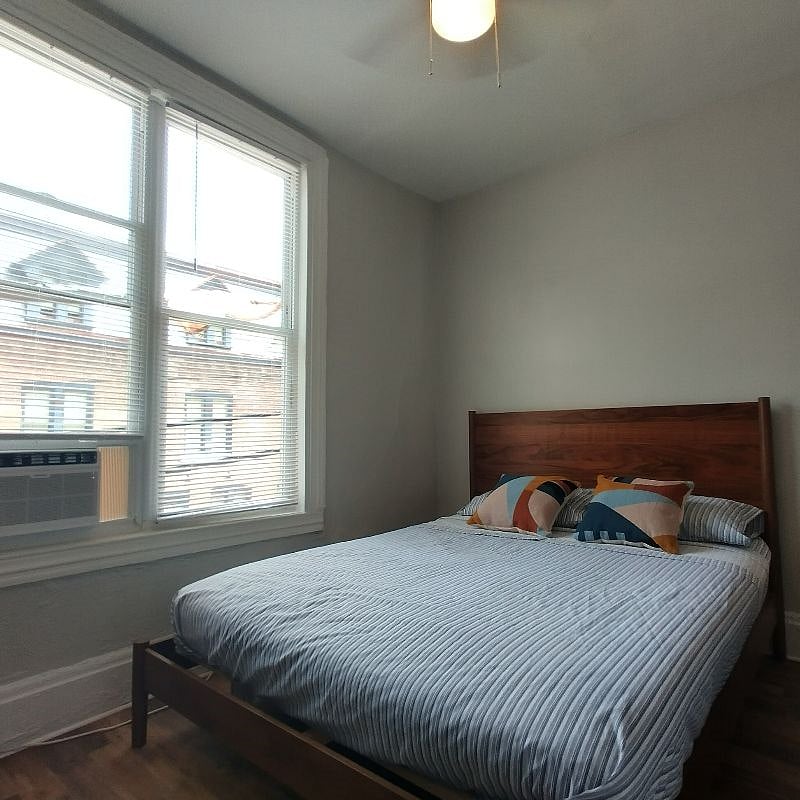 BEDROOM #2: 10 ft ceiling, ceiling fan, beautiful hardwood chest, closet, huge windows makes room always feel spacious and bright .