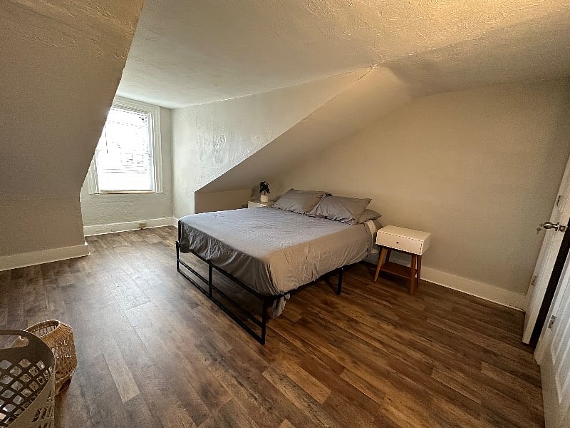 Top floor bedroom has queen bed, 2 night stands, dresser, closet and door lock. Comes together with the next door room. 2 rooms for price of one.