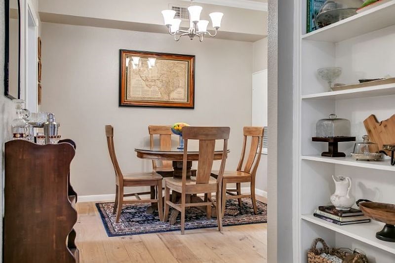 Condo is stocked with lots of extras for entertaining including a bar cabinet and alcove with appetizer and dessert serving ware.