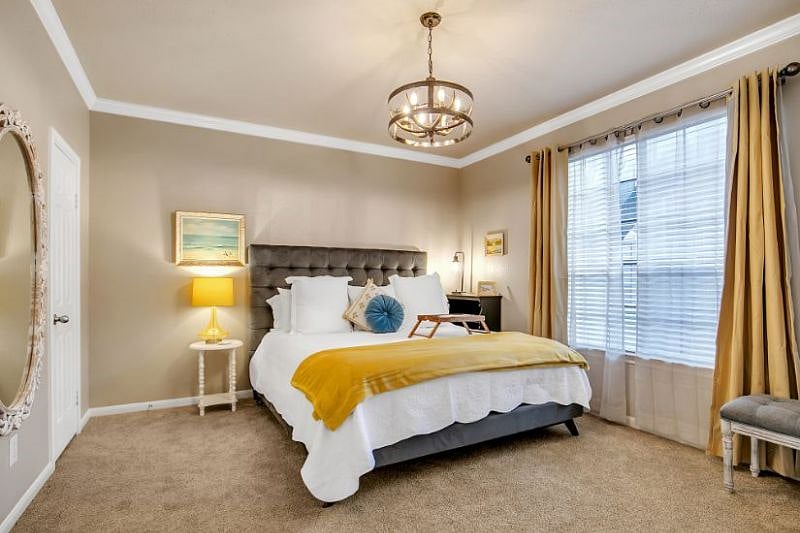 Spacious bedroom with king-size bed, high quality mattress with high end linens, pillows, blankets and down alternative comforter. 