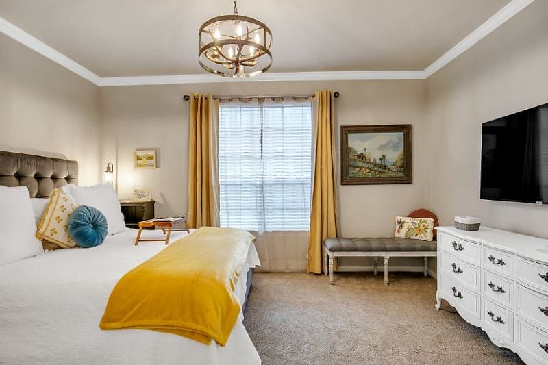 Large oversize window with blackout curtains, large smart TV with basic cable and huge dresser for clothes.