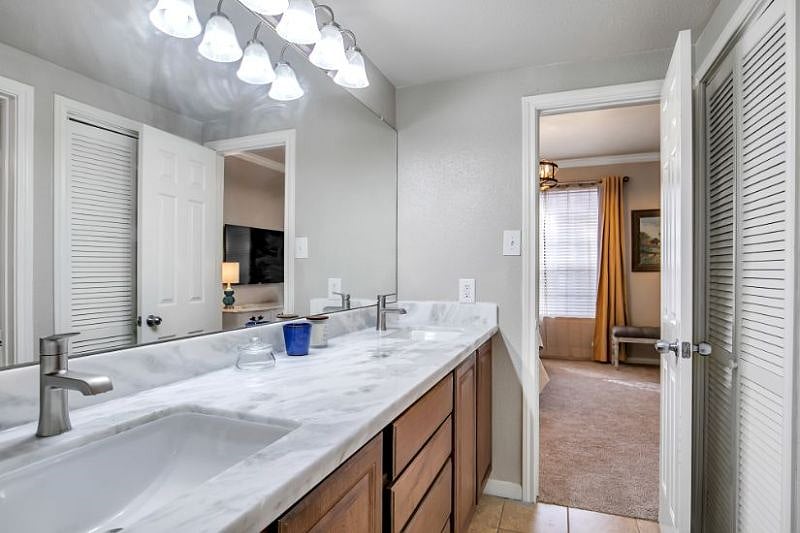 Large, updated bathroom with double sinks, beautiful quartzite counters and Kohler faucets.  All towels, hand towels and wash cloths provided. 