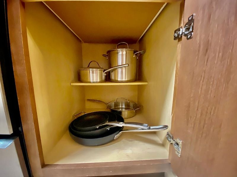 High end pots and pans, Calphalon skillets of various sizes.