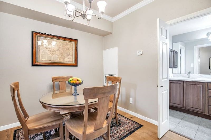 Separate dining area comfortably seats four.