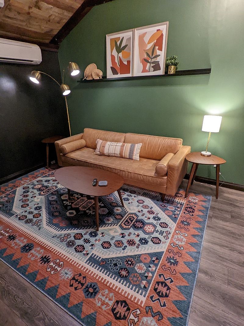 Dive into your favorite book and relax in your MCM living room