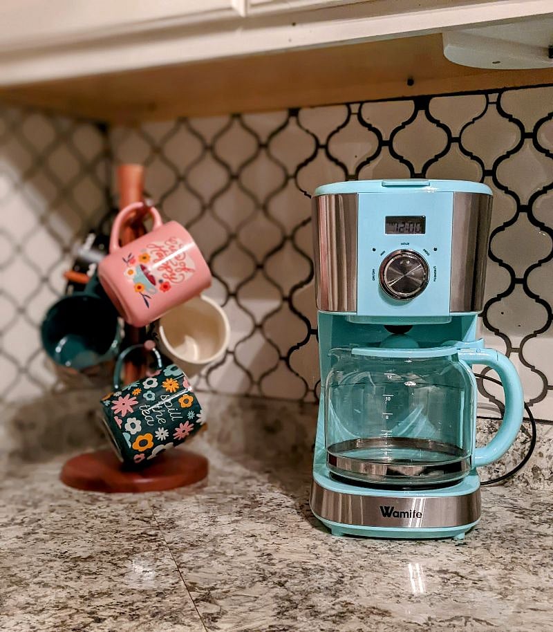 Cute coffee mug and coffee maker, check!