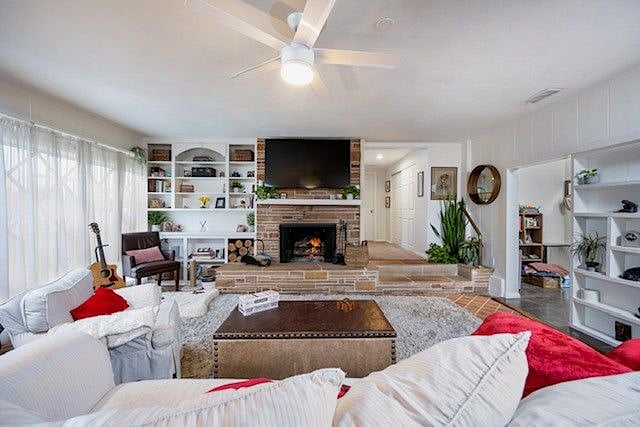 Cozy Family/Tv room with second Wood burning Fireplace.