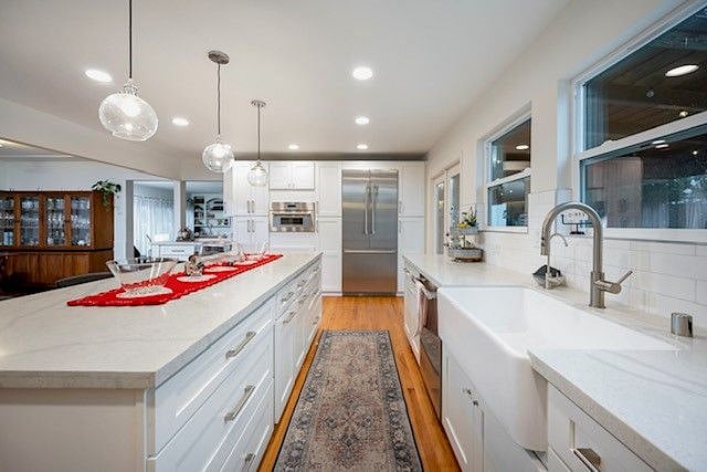 Built in counter depth fridge, seperate beverage fridge, dishwasher and touchscreen microwave.
