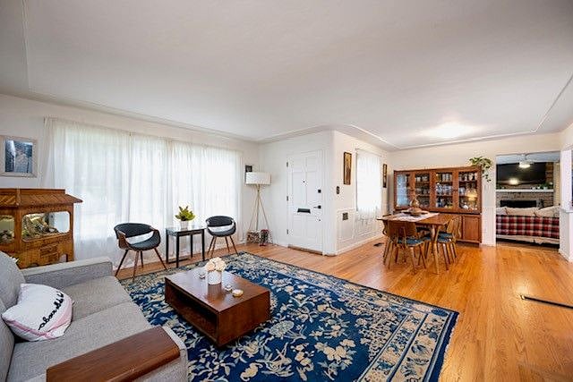 Bright and open concept Living room and dining room with wood burning fireplace