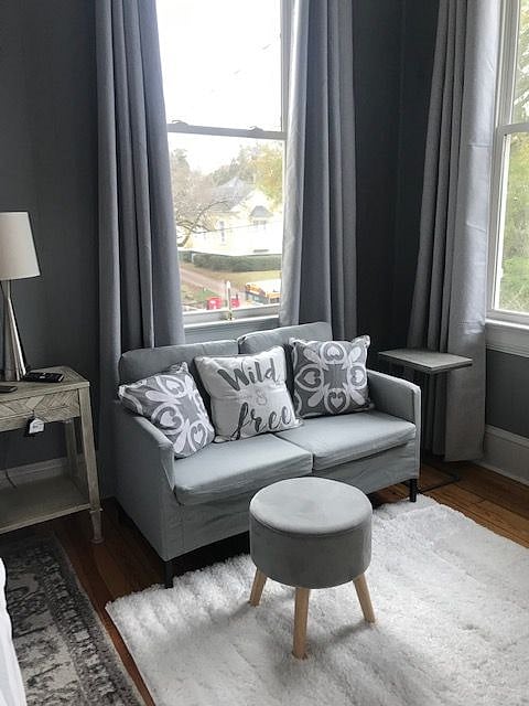 nice, well lit sitting area in this unit,  Lots of large windows with a great view of the street and also looks down onto your vehicle.