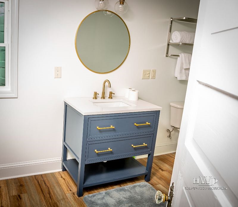 pretty blue vanity, and nice fixtures 