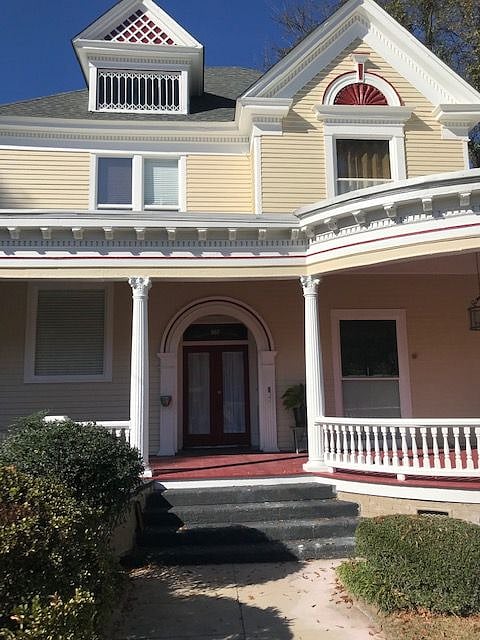 The house was recently updated and the porch painted a pretty red.